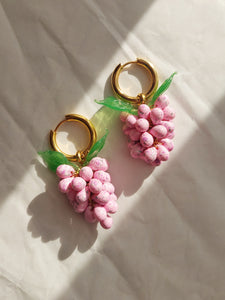 Pink glass drop earrings with a handmade grape charm.