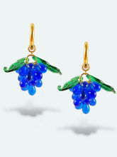 Load image into Gallery viewer, Handmade gold hoop earrings with grape charm made of blue glass drops.