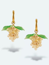 Load image into Gallery viewer, Handmade gold hoop earrings with grape charm made of beige glass drops.
