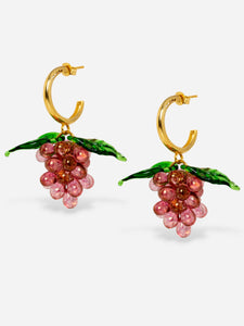 Grape earrings made of gold plated sterling silver hoops and glasss beads.