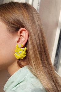 Handmade statement colourful flower beaded earrings with a retro style.