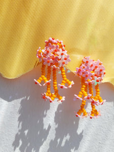 Handmade statement flower beaded earrings with a retro style.