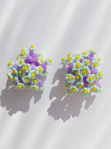 Handmade statement flower beaded earrings with a retro style.
