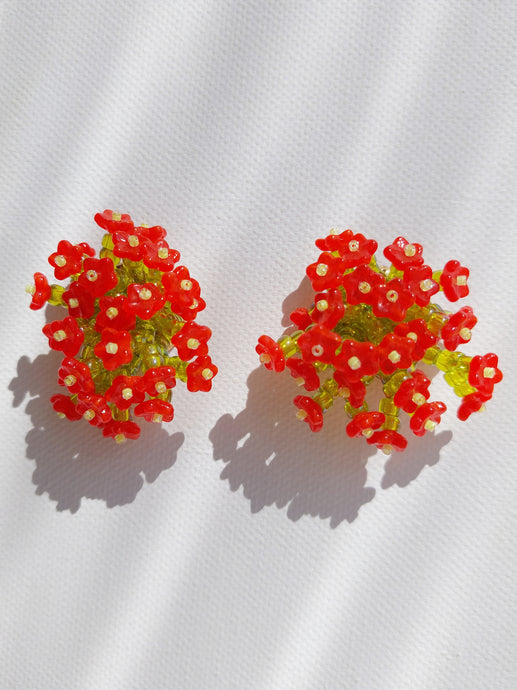 Handmade statement colourful flower beaded earrings with a retro style.