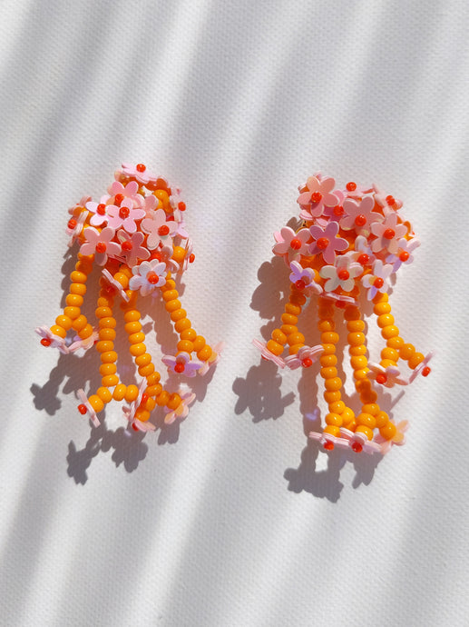 Handmade statement flower beaded earrings with a retro style.