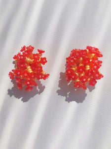 Handmade statement colourful flower beaded earrings with a retro style.
