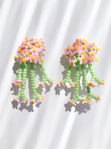 Handmade statement flower beaded earrings with a retro style.