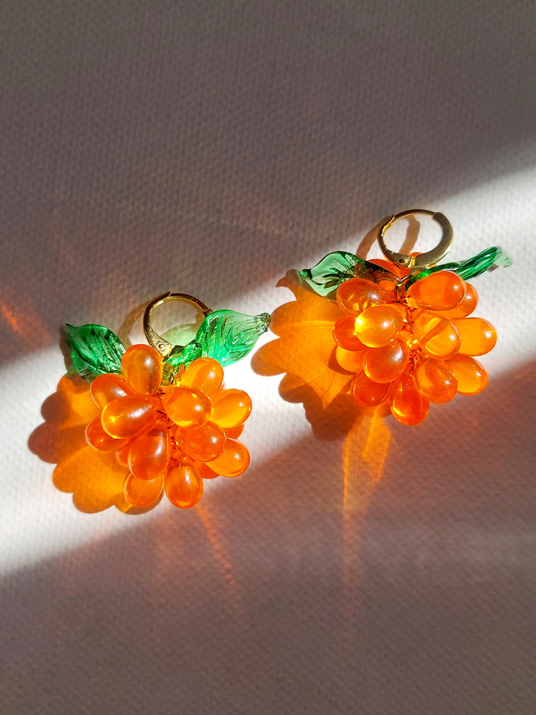 Berries huggie hoop earrings made of glass Czech and Murano beads. The perfect colourful jewelry.