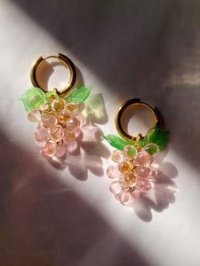 Handmade pink glass fruit earrings.