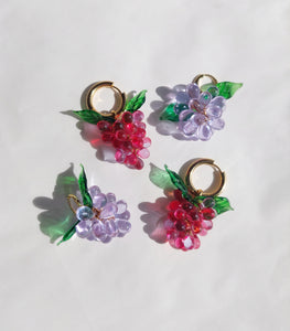 Handmade gold hoop earrings with grape charm made of colorful glass beads.