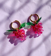 Load image into Gallery viewer, Handmade gold hoop earrings with grape charm made of red glass beads.